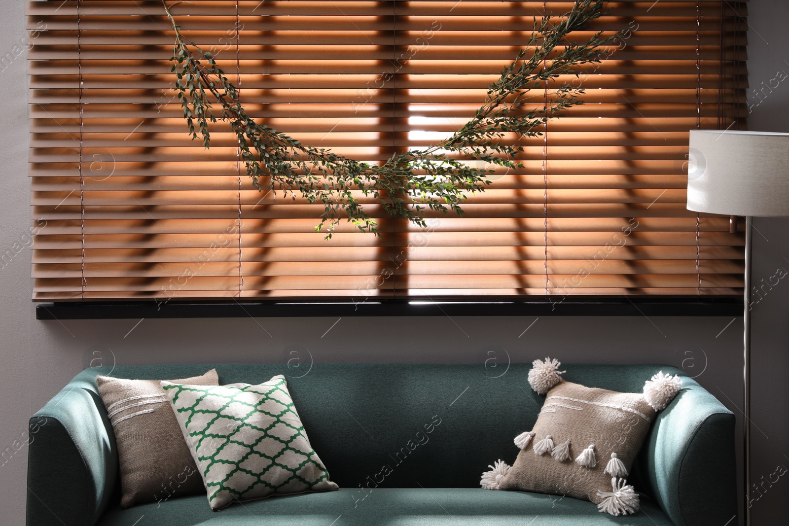 Photo of Stylish room decorated with beautiful eucalyptus garland