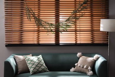 Photo of Stylish room decorated with beautiful eucalyptus garland