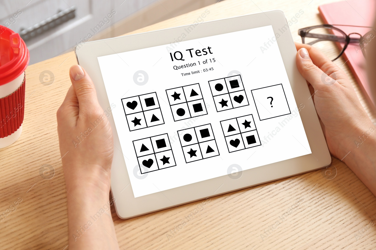 Image of Woman using tablet for taking IQ test indoors, closeup