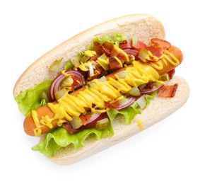 Photo of Delicious hot dog with bacon, lettuce, onion and pickle isolated on white, top view