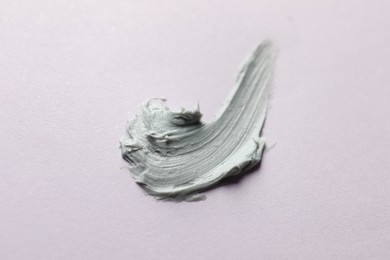 Sample of face mask on pink background, top view