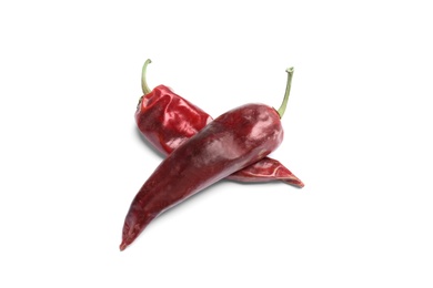 Dry chili peppers on white background