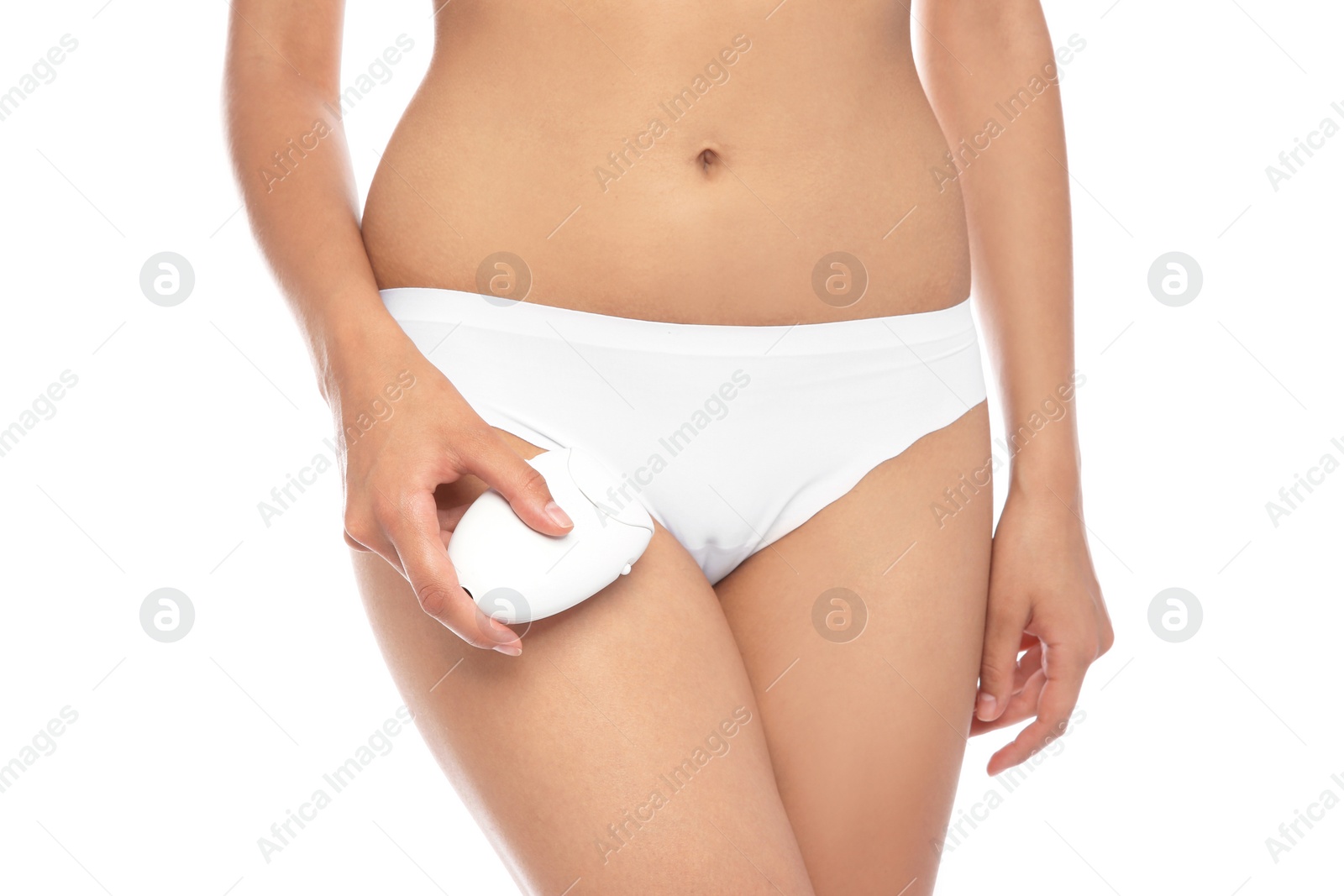 Photo of Young woman epilating bikini area on white background