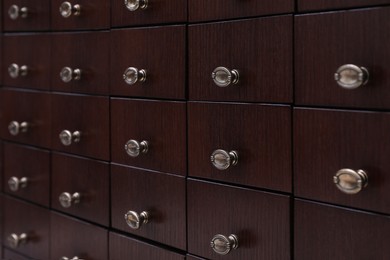 Photo of Library catalog. Wooden chest of drawers, closeup
