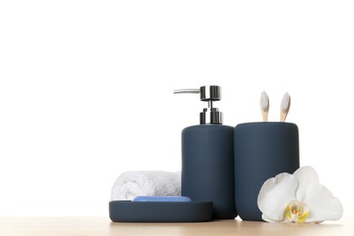 Bath accessories. Different personal care products and flower on wooden table against white background. Space for text