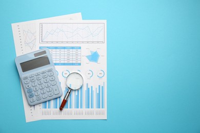 Photo of Accounting documents, magnifying glass and calculator on light blue background, top view. Space for text