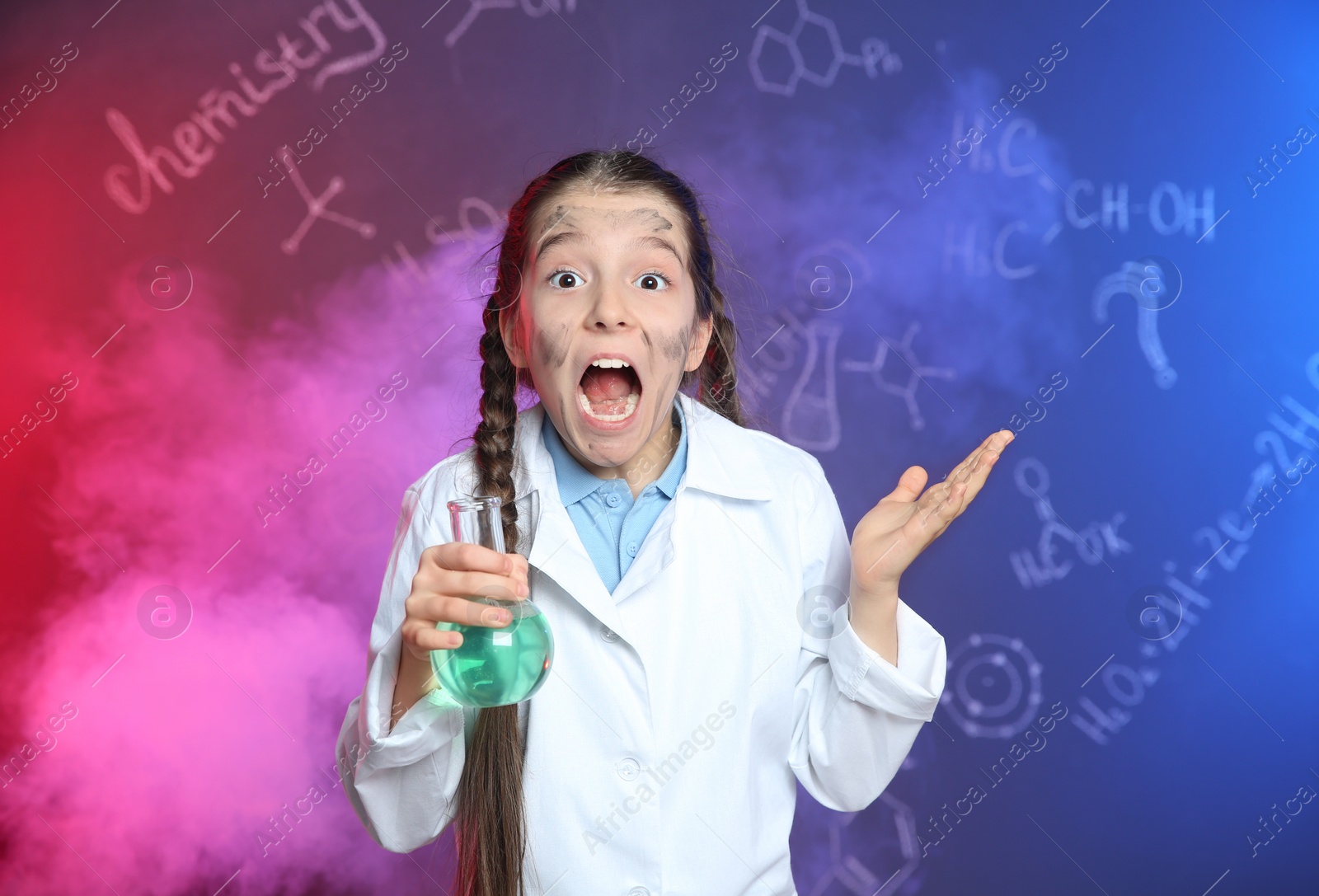 Photo of Emotional pupil holding Florence flask in smoke against blackboard with chemistry formulas