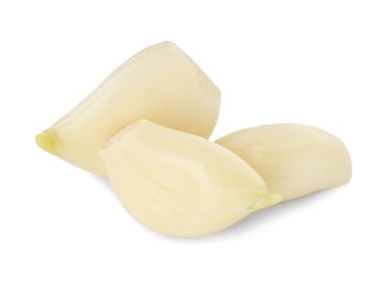 Photo of Peeled cloves of fresh garlic isolated on white
