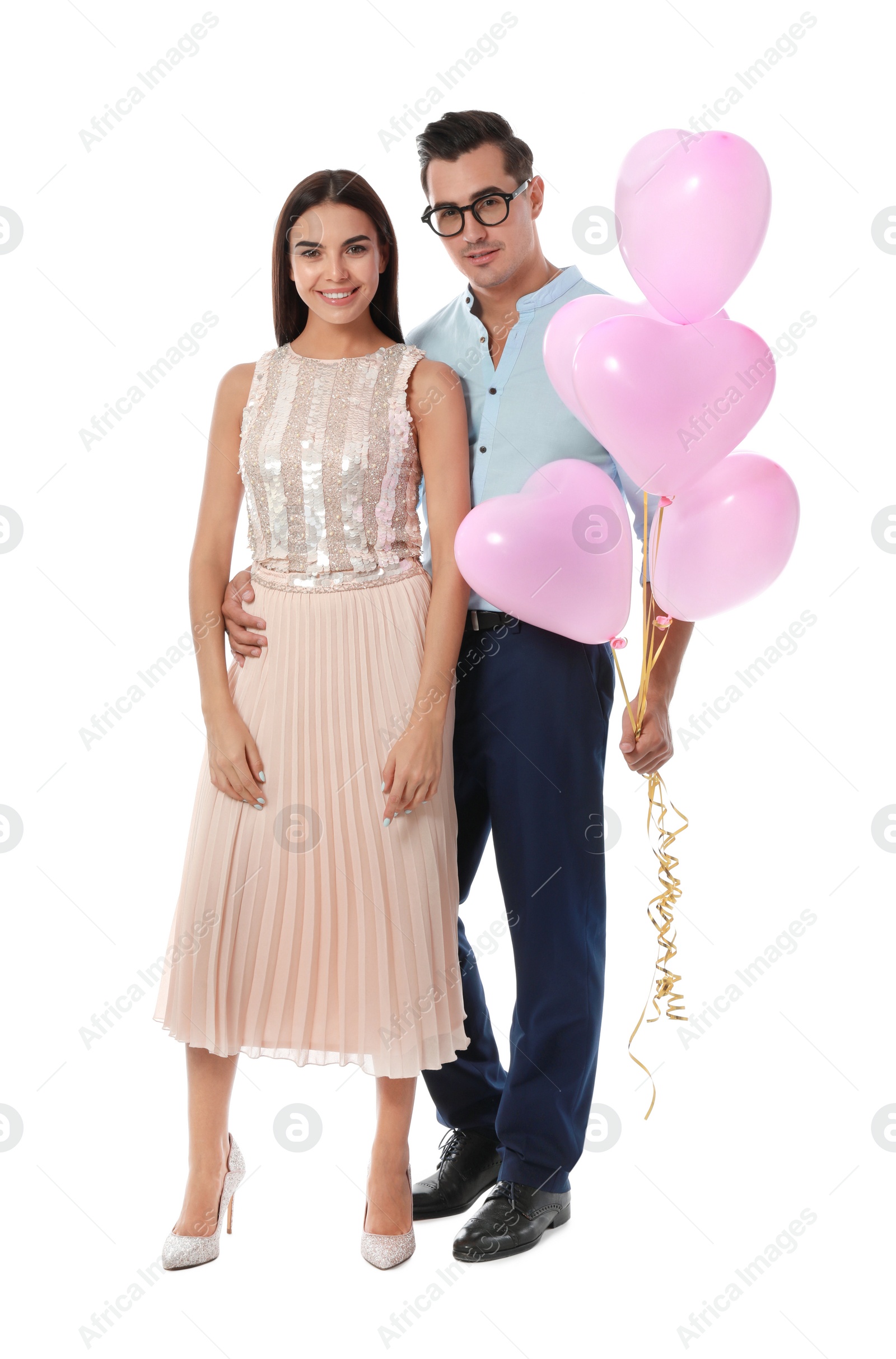 Photo of Beautiful couple with heart shaped balloons on white background