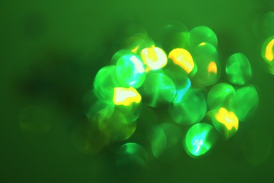 Image of St. Patrick day. Green background with blurred lights, bokeh effect