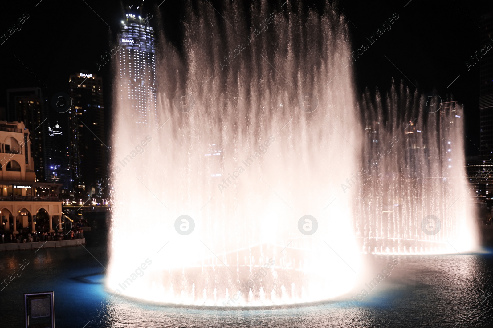 Photo of DUBAI, UNITED ARAB EMIRATES - NOVEMBER 04, 2018: Famous dancing fountain show on Burj Khalifa lake at night