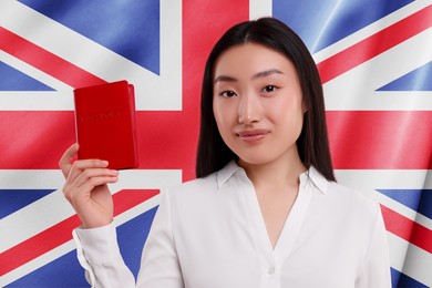 Immigration. Woman with passport against national flag of United Kingdom