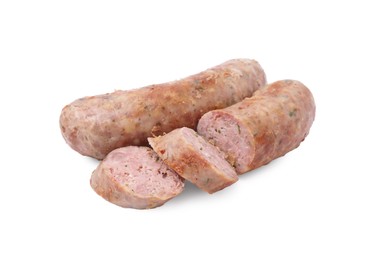 Photo of Tasty whole and cut homemade sausages isolated on white