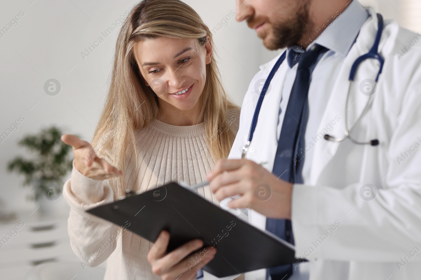 Photo of Professional doctor working with patient in hospital