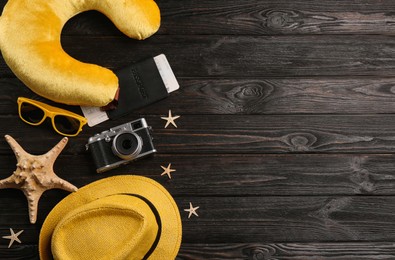Image of Flat lay composition with yellow travel pillow on wooden background, space for text