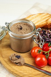 Delicious liver pate on wooden board, closeup view