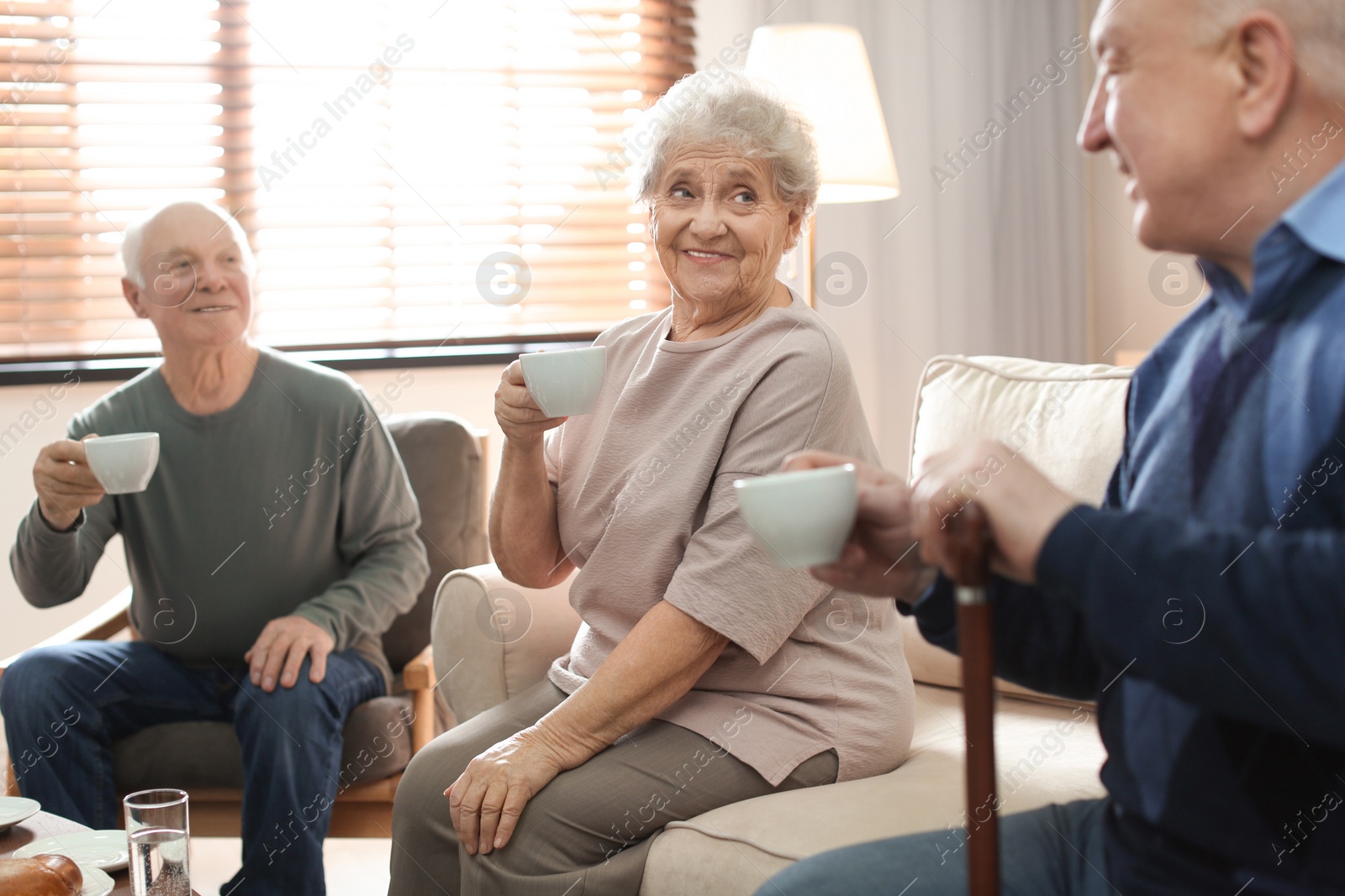 Photo of Elderly people spending time in geriatric hospice. Senior patients care