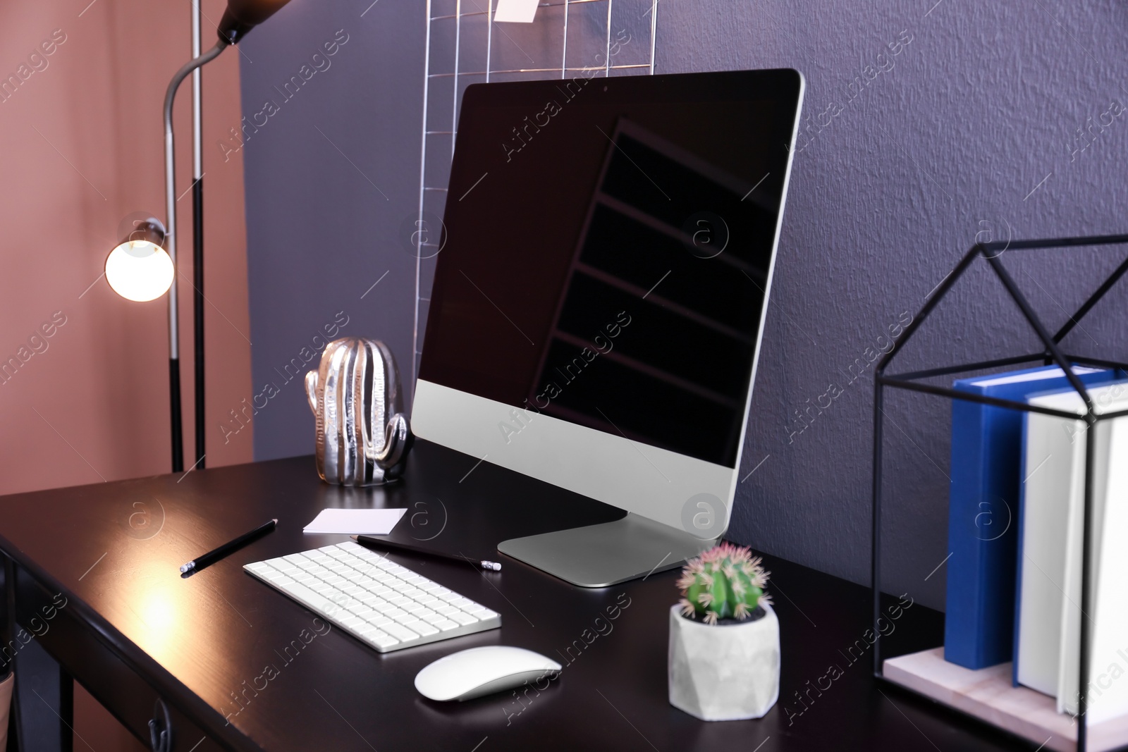 Photo of Comfortable workplace with computer on desk in home office