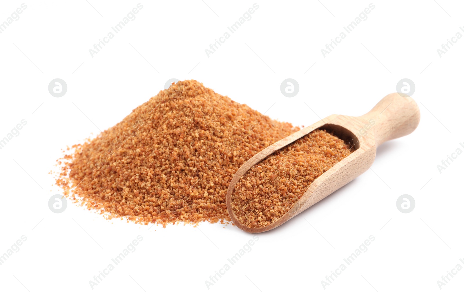 Photo of Natural coconut sugar and wooden scoop on white background