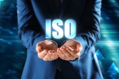 Man demonstrating virtual icon with abbreviation ISO, closeup