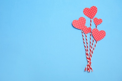 Photo of Composition with small paper hearts on color background