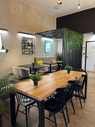 Photo of WARSAW, POLAND - JULY 17, 2022: Stylish cafe interior with modern furniture