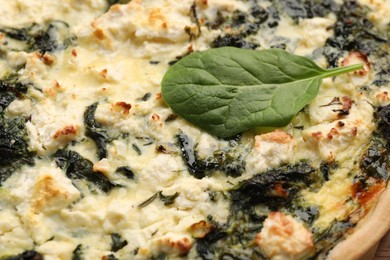 Delicious homemade spinach quiche as background, closeup