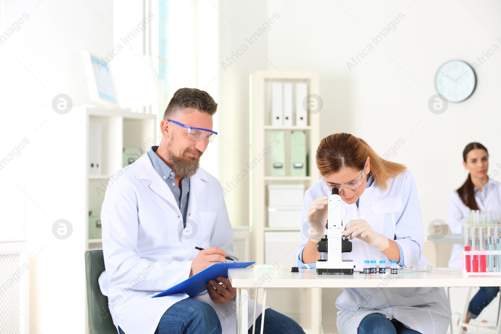 Photo of Scientists working in laboratory. Research and analysis