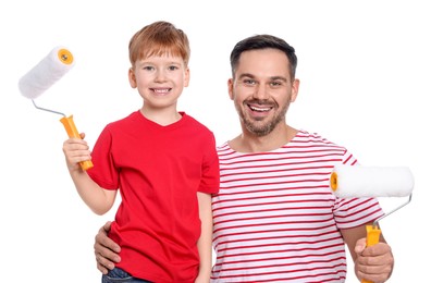 Photo of Father and son holding paint rollers on white background. Repair work