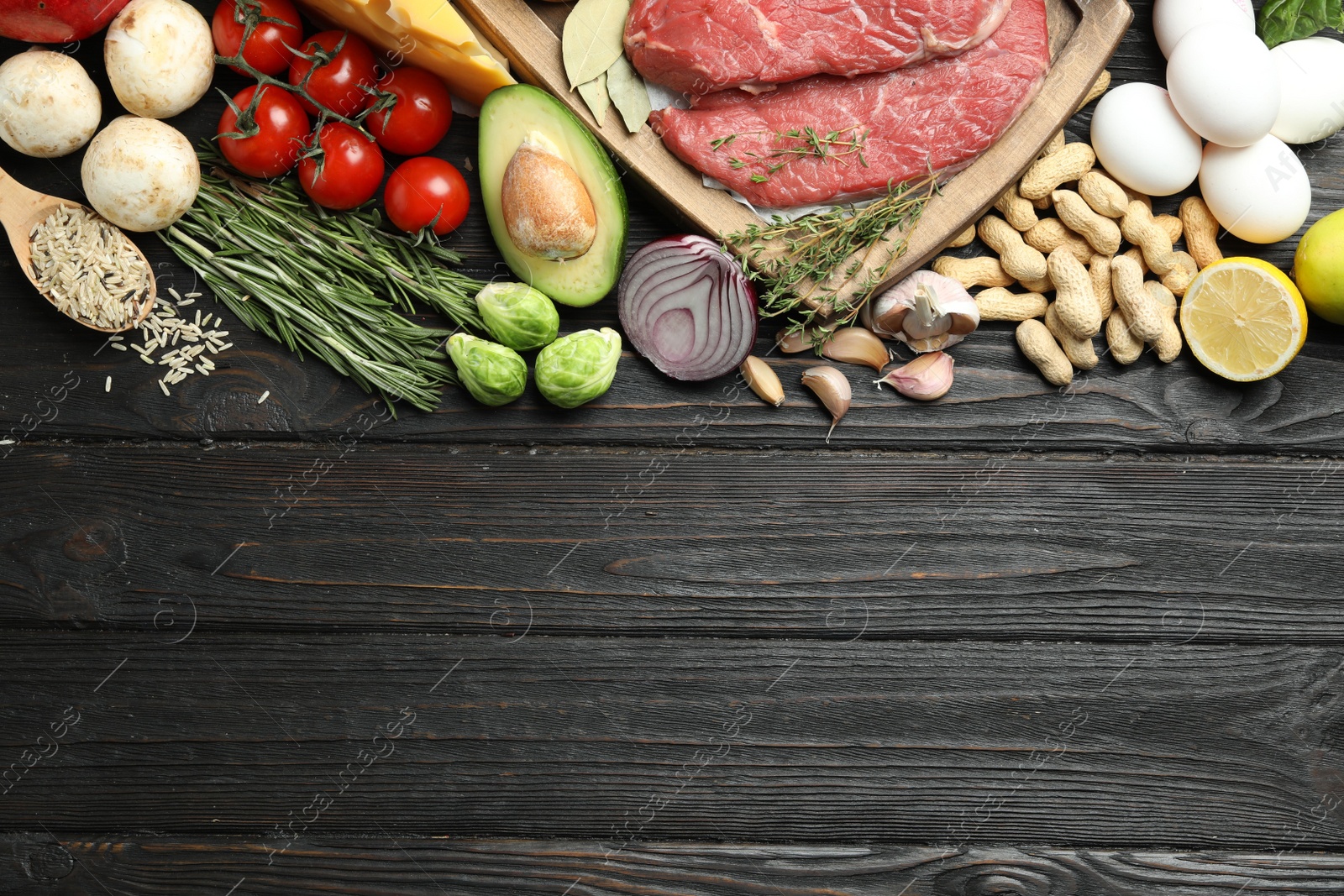 Photo of Flat lay composition with fresh meat and other products on wooden table, space for text. Balanced diet