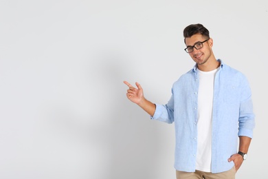 Portrait of handsome young man and space for text on white background