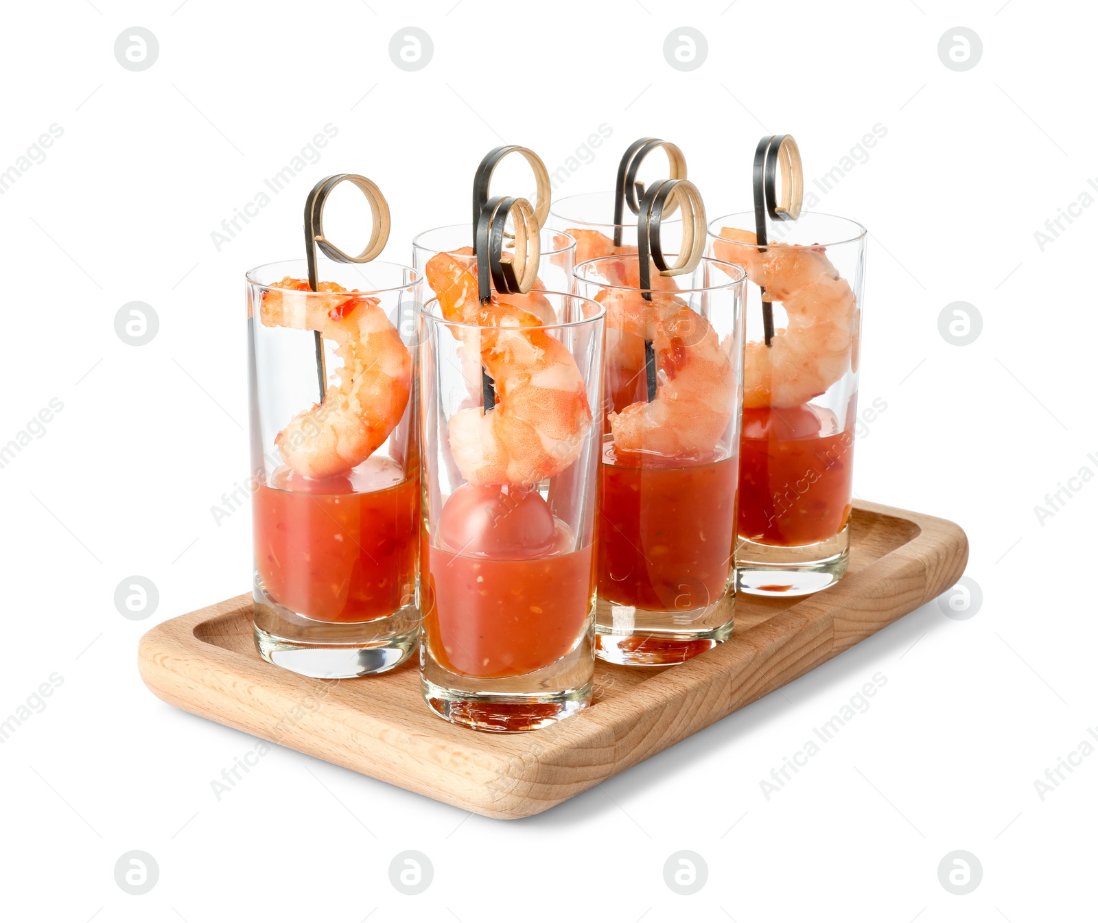 Photo of Tasty canapes with shrimps, tomatoes and sauce in shot glasses isolated on white