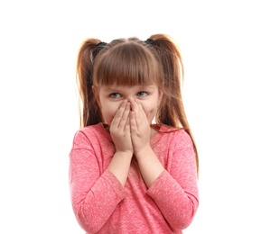 Cute little girl coughing against white background