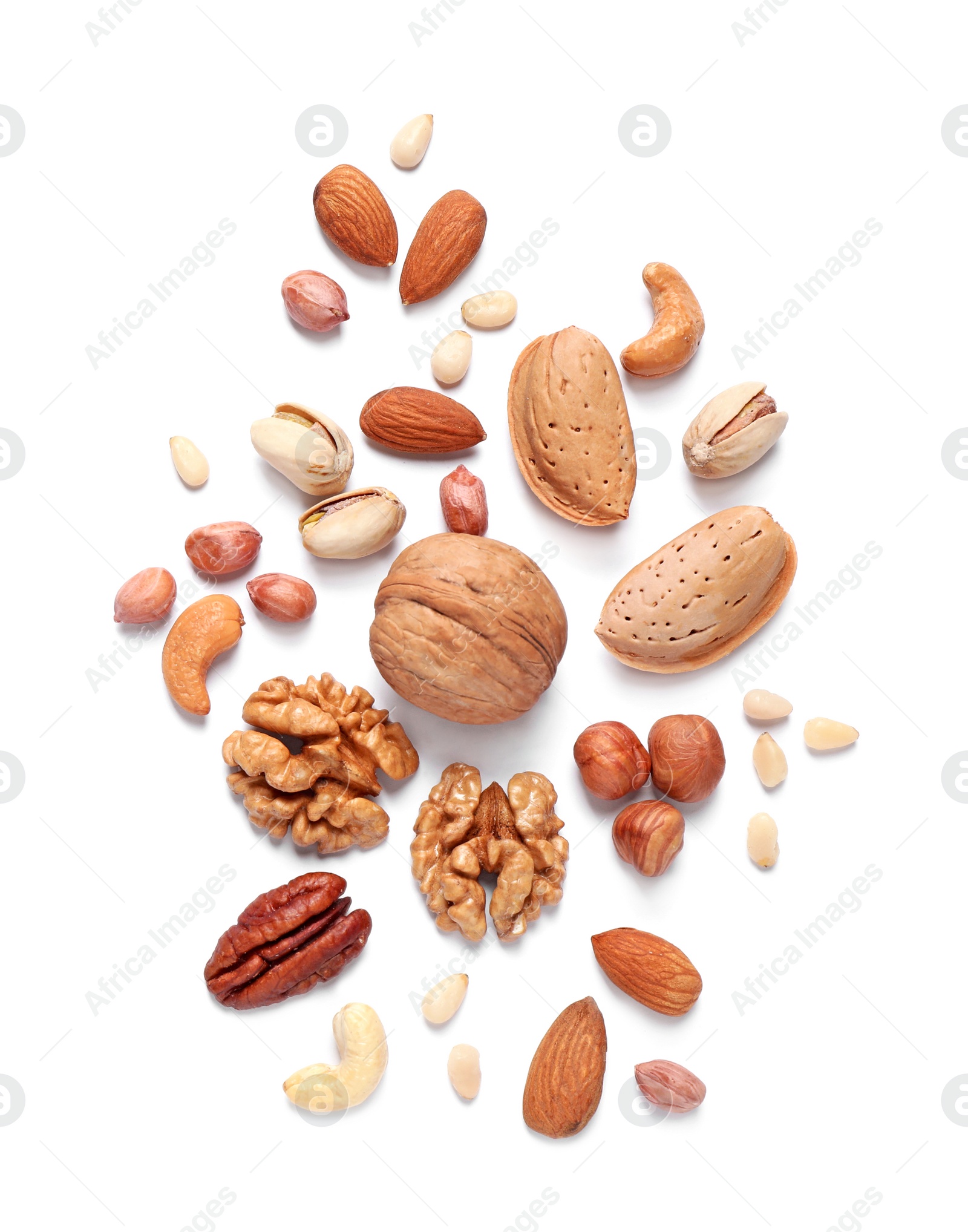 Photo of Different delicious nuts on white background, flat lay. Space for text