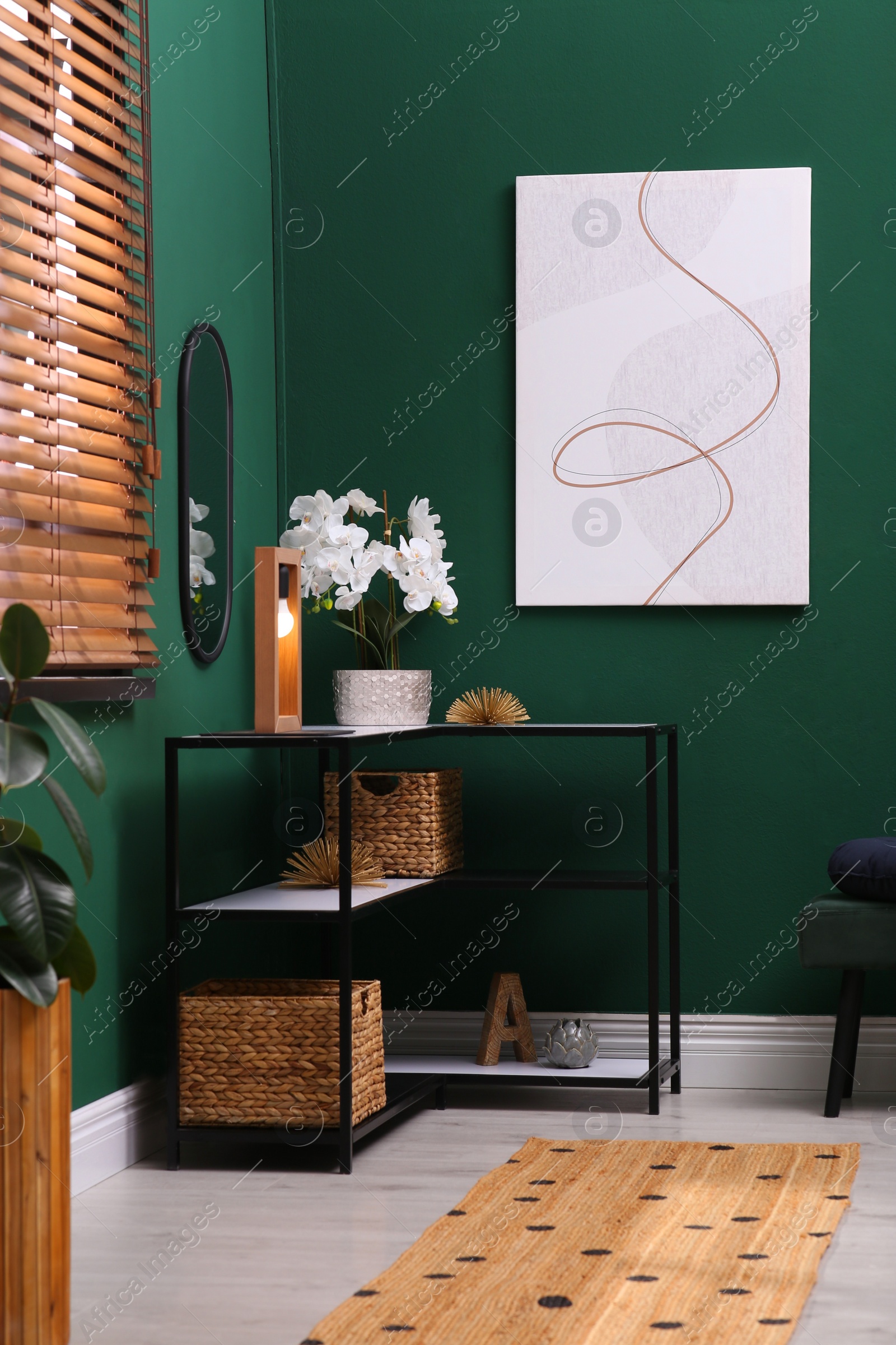 Photo of Modern hallway interior with console table and beautiful orchid flower