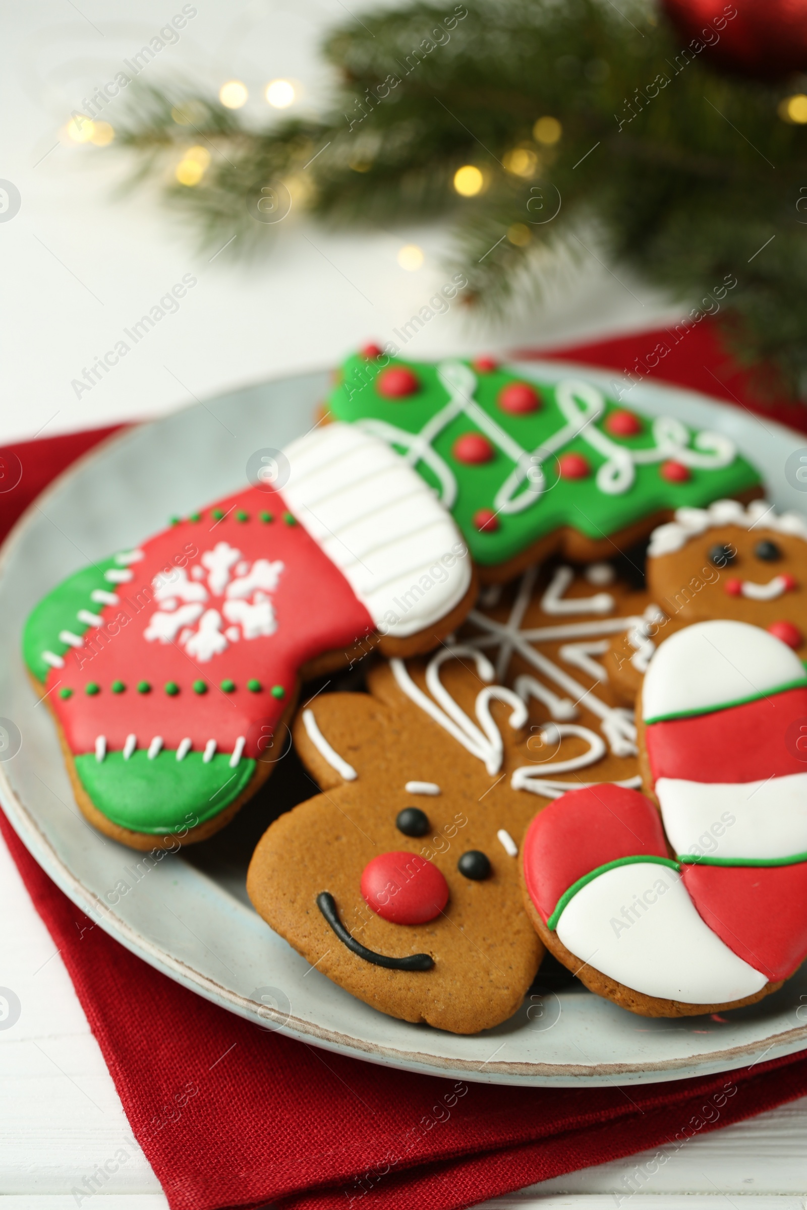 Photo of Tasty homemade Christmas cookies on white wooden table, closeup