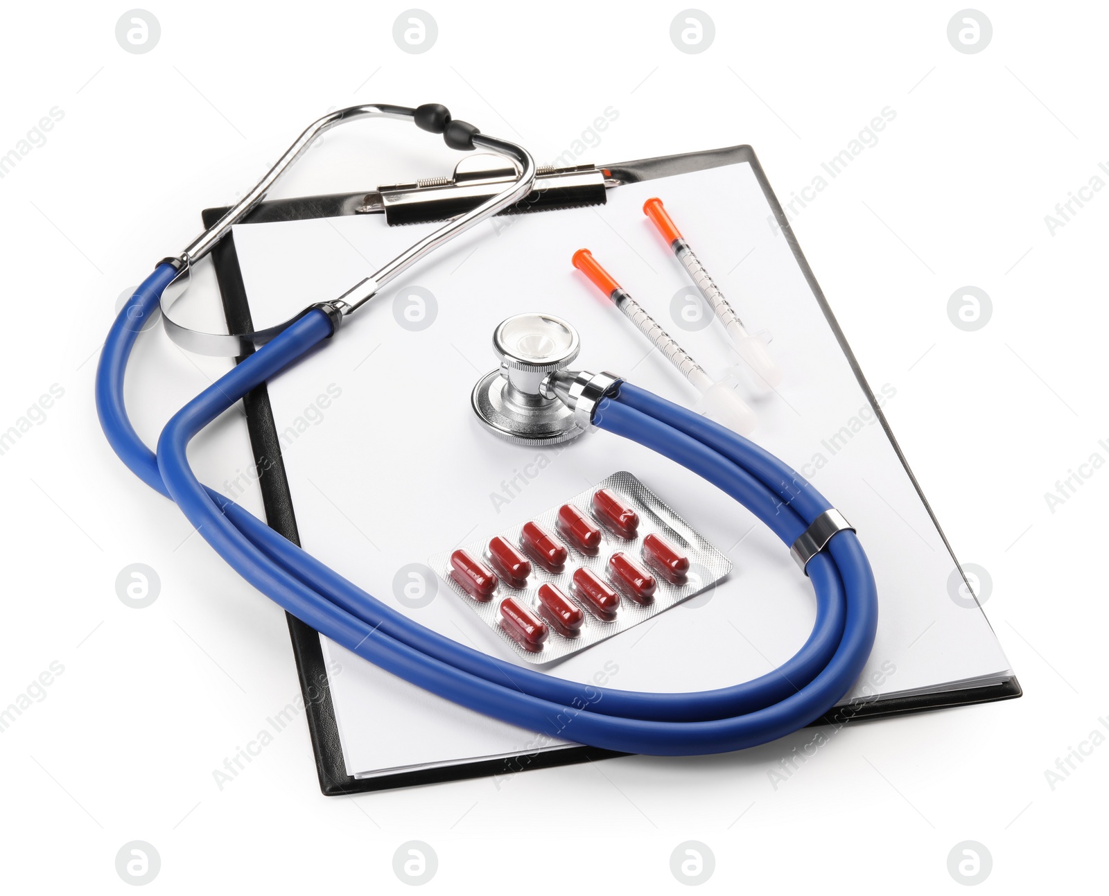 Photo of Stethoscope, pills, syringes and clipboard isolated on white. Medical tools