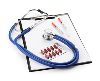 Photo of Stethoscope, pills, syringes and clipboard isolated on white. Medical tools