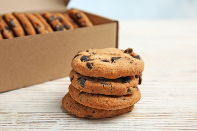 Delicious chocolate chip cookies on wooden table