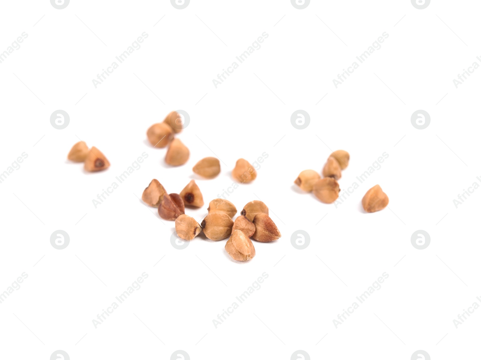 Photo of Uncooked buckwheat on white background. Healthy diet