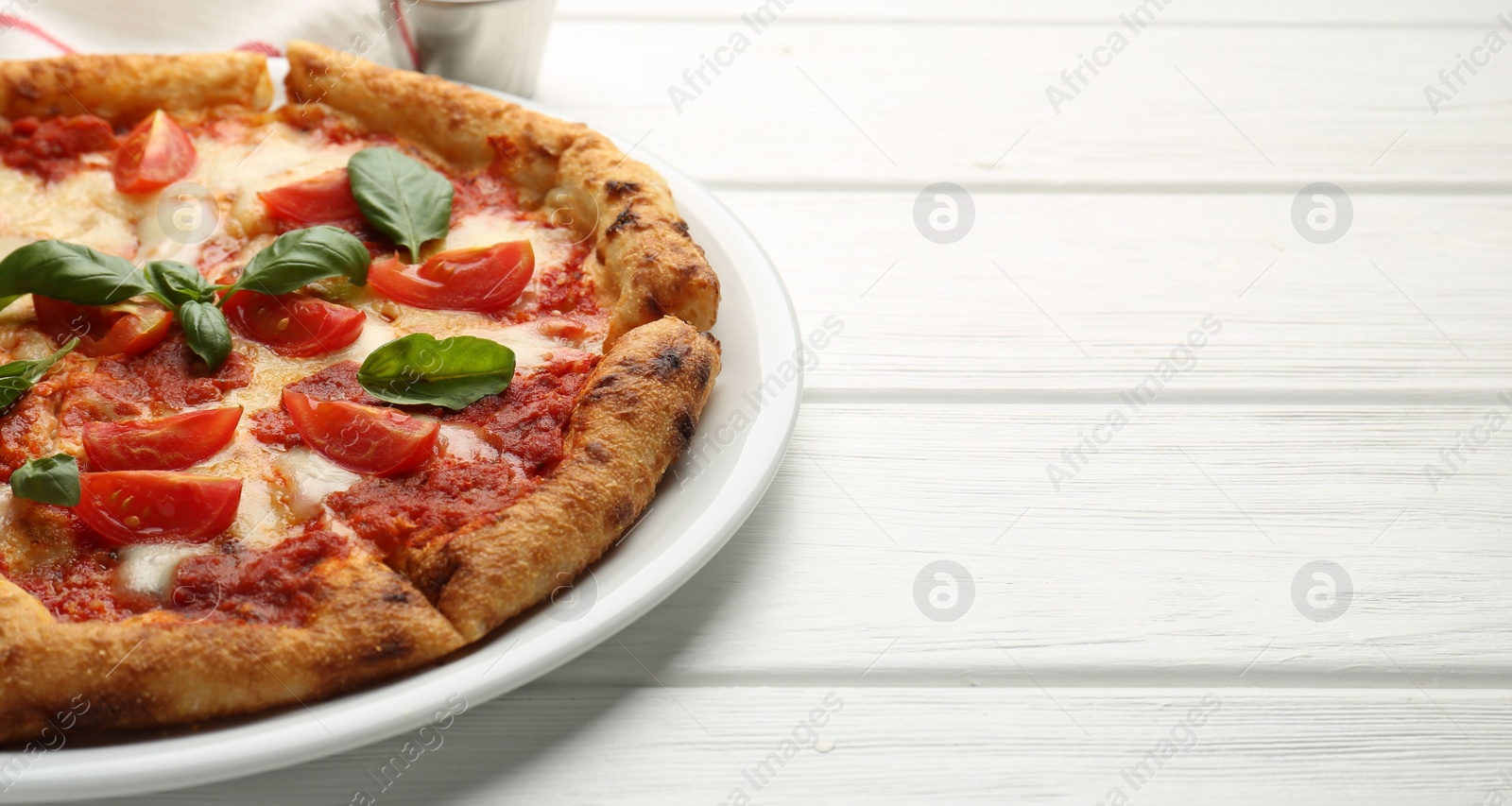Photo of Delicious Margherita pizza on white wooden table, closeup. Space for text
