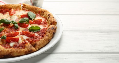 Photo of Delicious Margherita pizza on white wooden table, closeup. Space for text