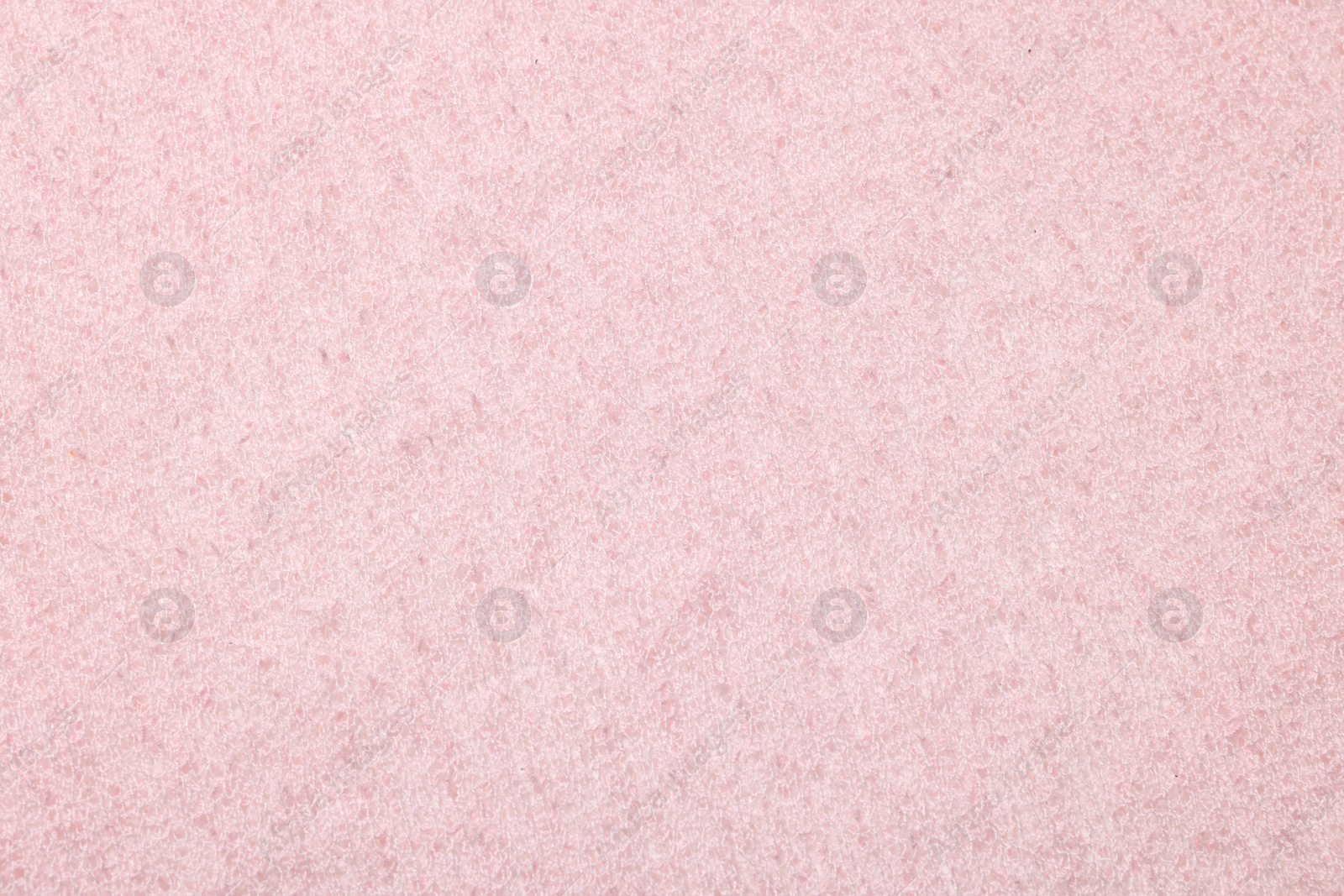 Photo of Texture of soft pink fabric as background, top view