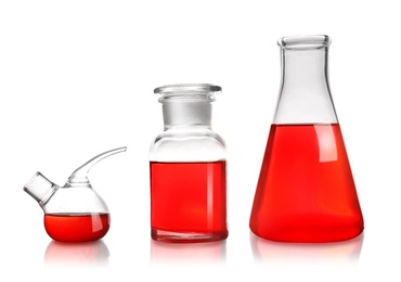 Laboratory glassware with liquid on white background. Solution chemistry