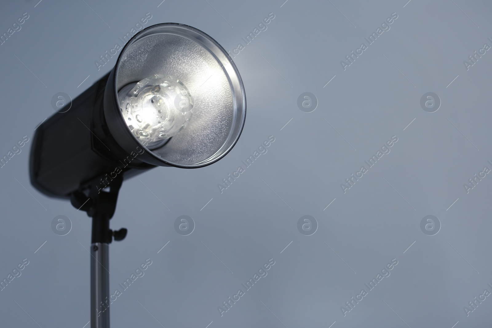 Photo of Studio lighting against gray background. Professional photo equipment