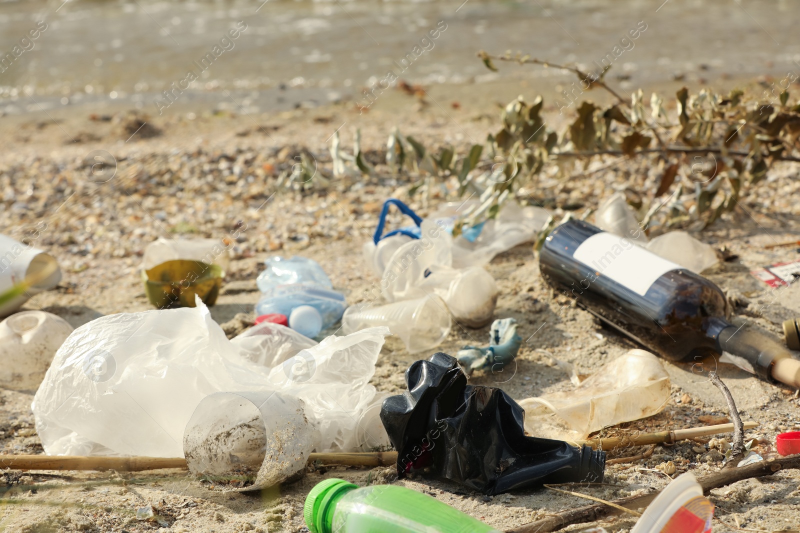 Photo of Garbage scattered on beach. Environment pollution problem