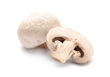 Photo of Fresh champignon mushrooms on white background, closeup