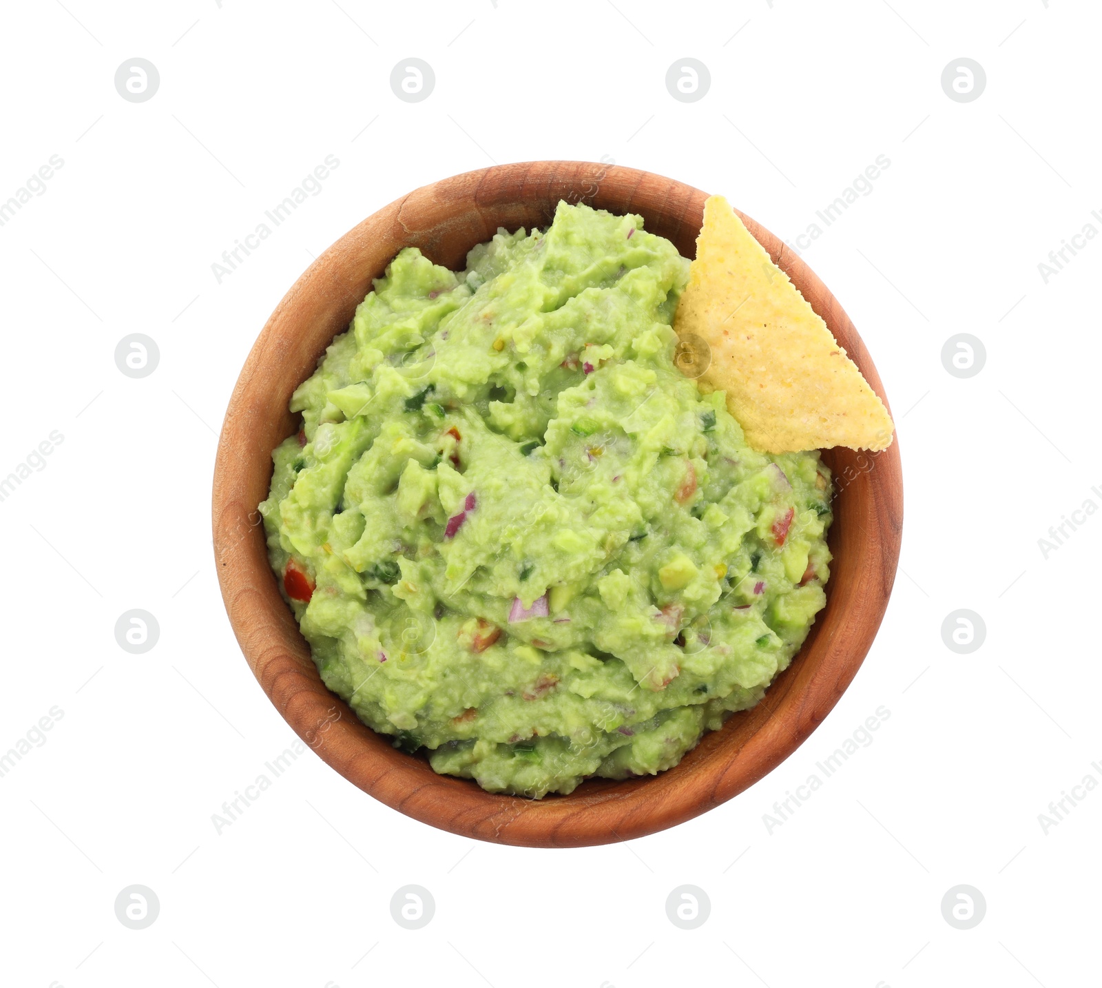 Photo of Bowl of delicious guacamole with nachos chips isolated on white, top view