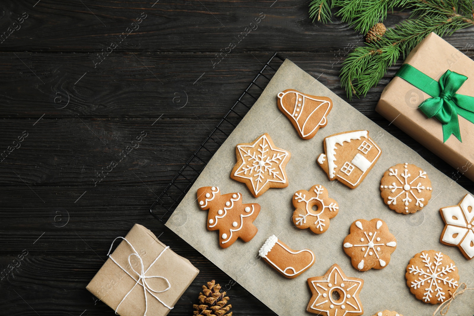 Photo of Flat lay composition with tasty homemade Christmas cookies on wooden table