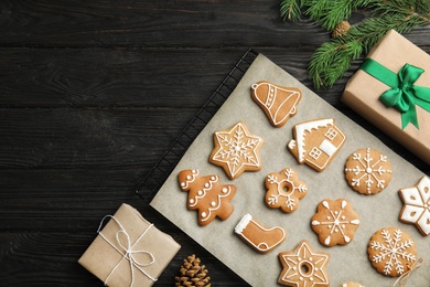 Flat lay composition with tasty homemade Christmas cookies on wooden table